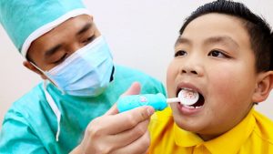 dentist checking how the dental patient bites